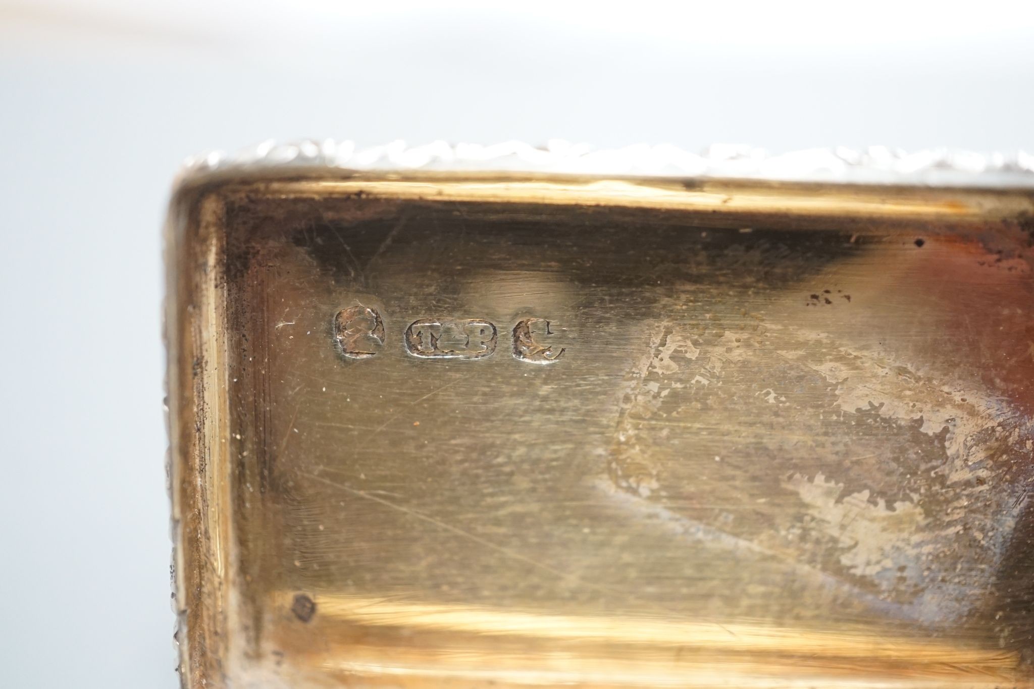 A William IV engraved silver rectangular vinaigrette, with engraved initials, Taylor & Perry, Birmingham, 1833, 42mm and a later oval vinaigrette, by George Unite.